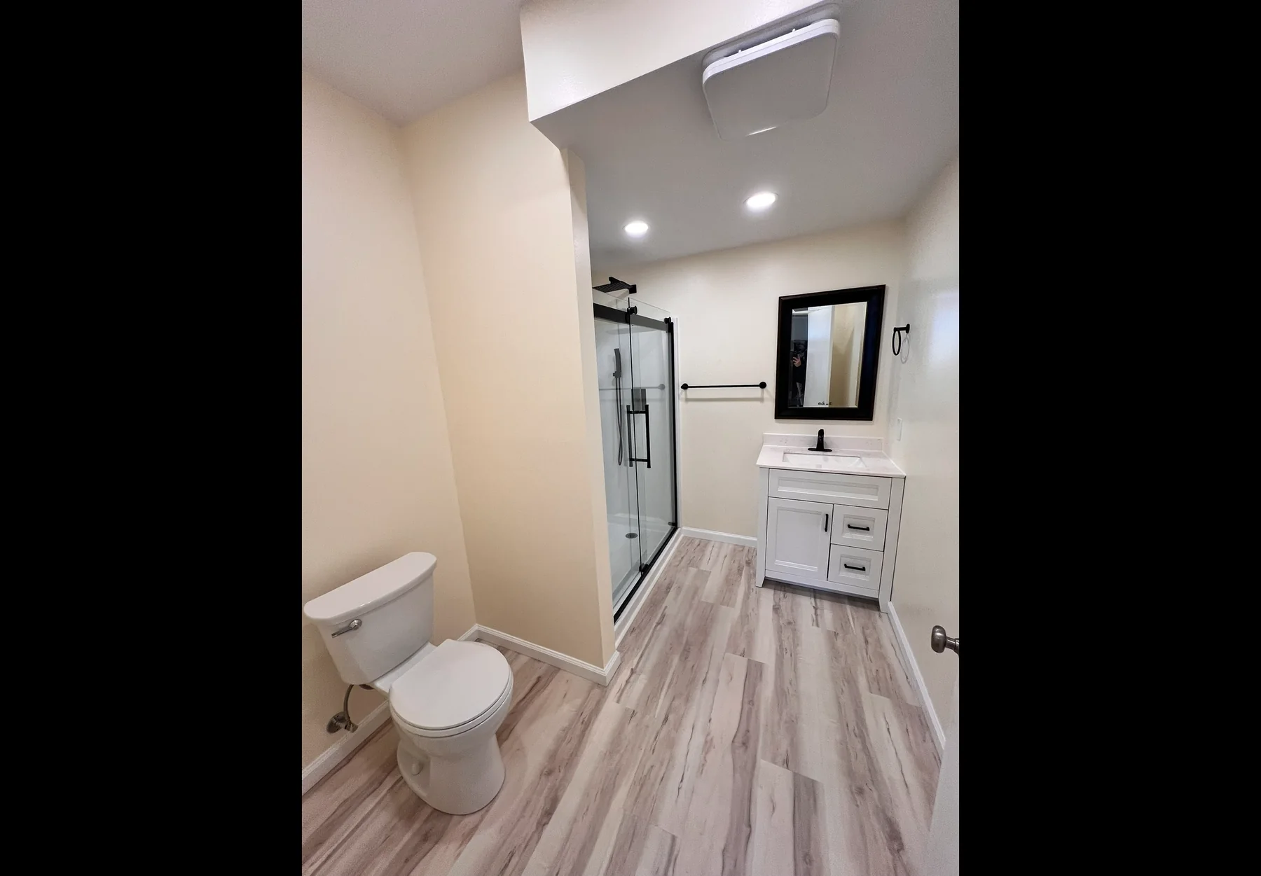 Finished bathroom renovation with shower and vanity