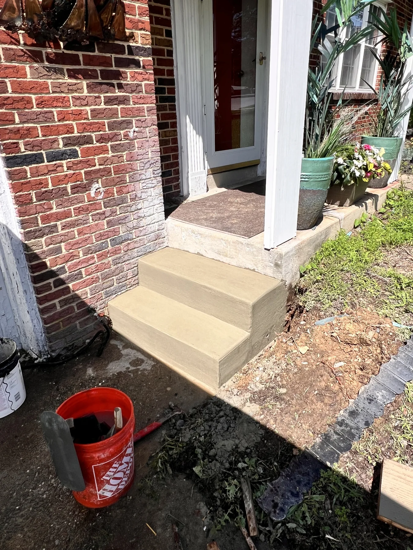 New concrete steps at a brick home
